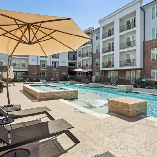 Relax and unwind poolside pool with lounge chairs