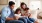 lifestyle image of a family in a living room on the couch