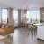 open living concept showing living room and kitchen combined with ample space for seating and modern living room decor